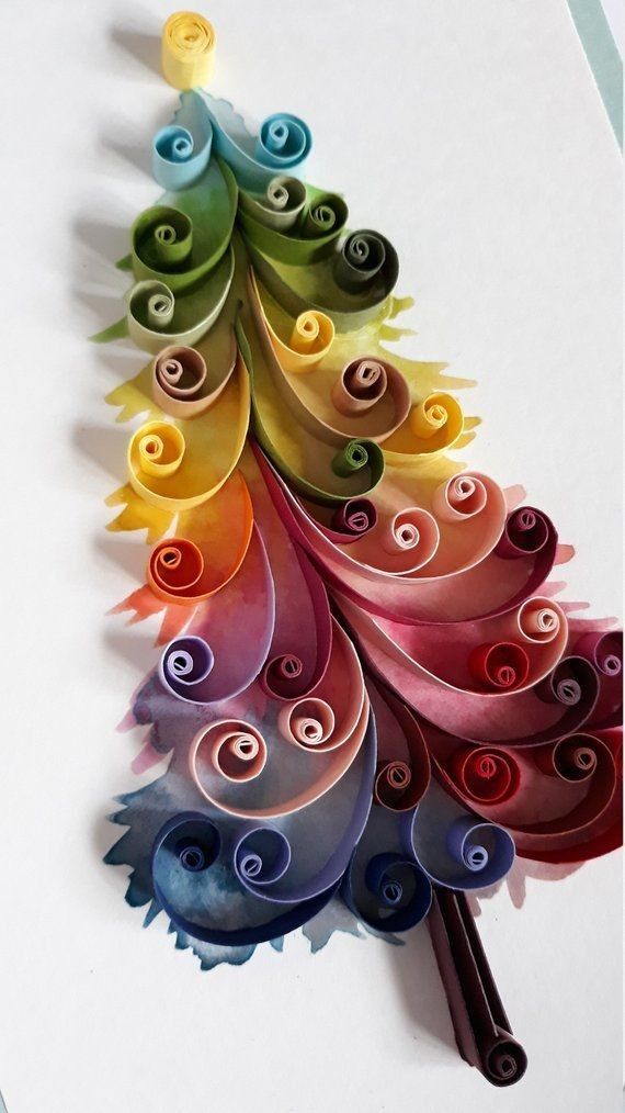 a colorful christmas tree made out of paper