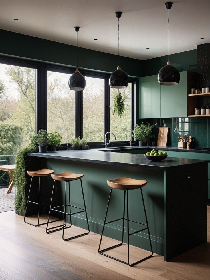 a kitchen with green walls and wooden floors, two bar stools on the counter