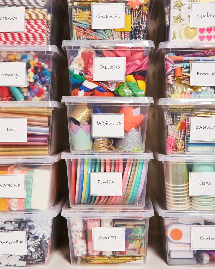 several plastic containers filled with different types of crafting supplies and labeled labels on them