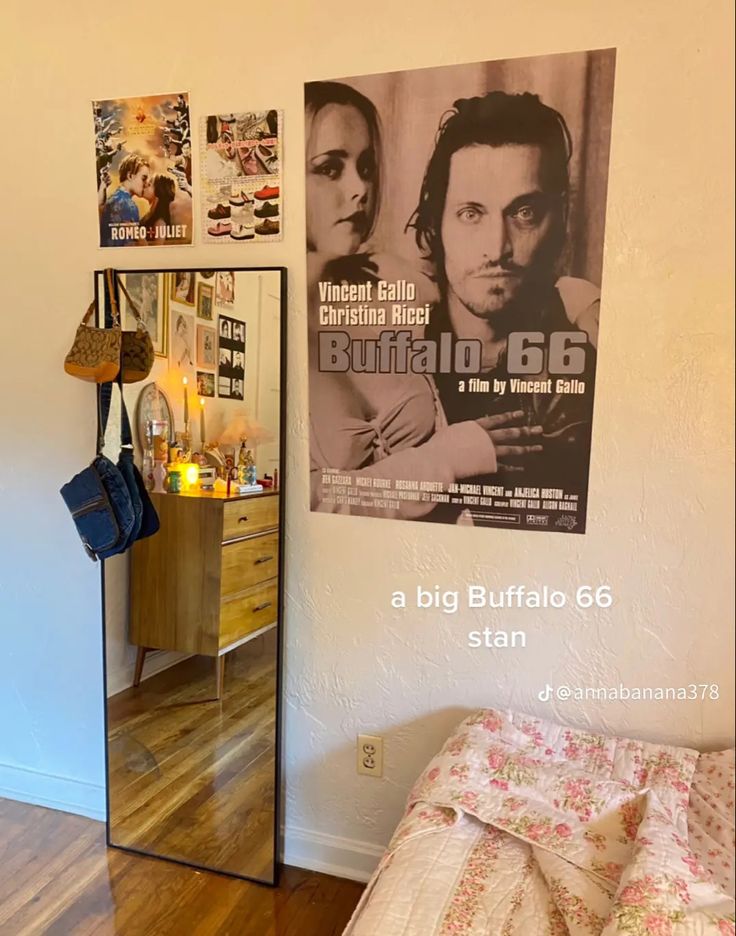 a bedroom with a poster on the wall