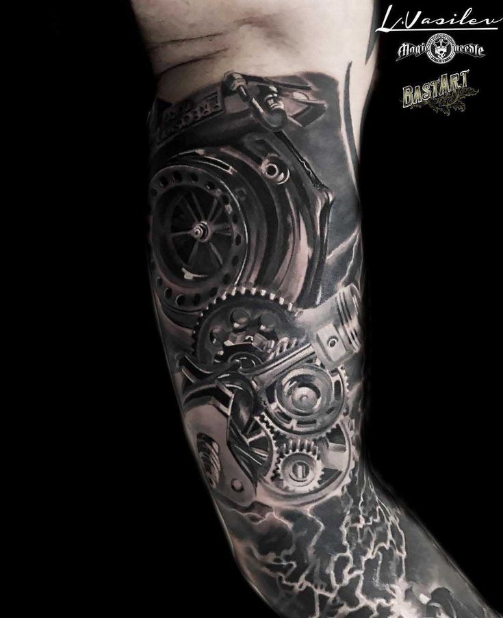 a man's arm with a clock and gears tattoo design on it, in black and white