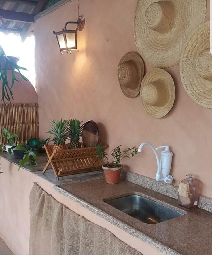 a kitchen counter topped with lots of pots and pans