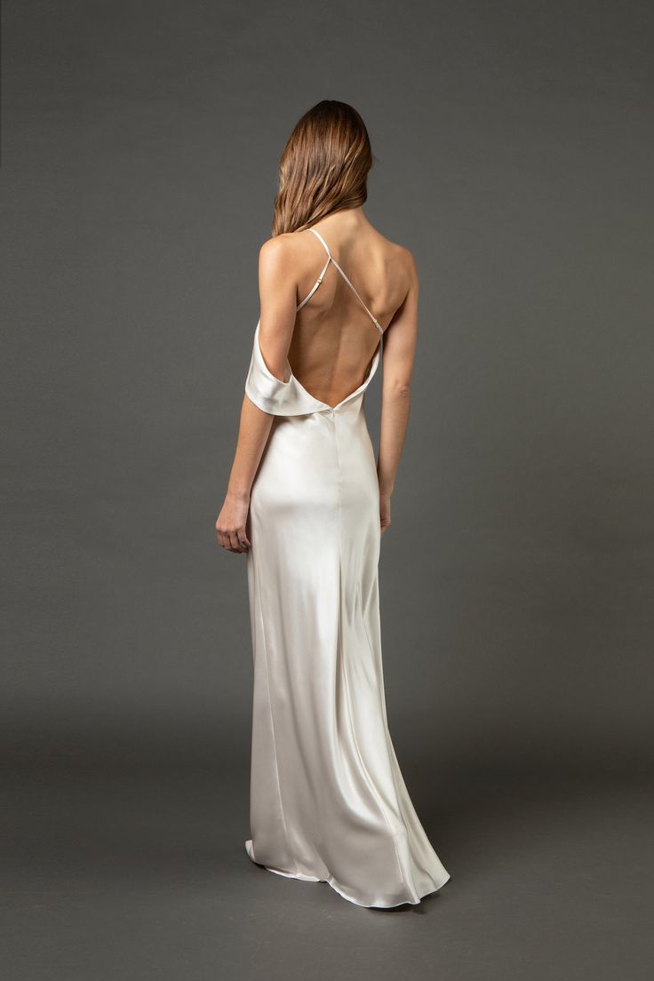 the back of a woman in a white dress