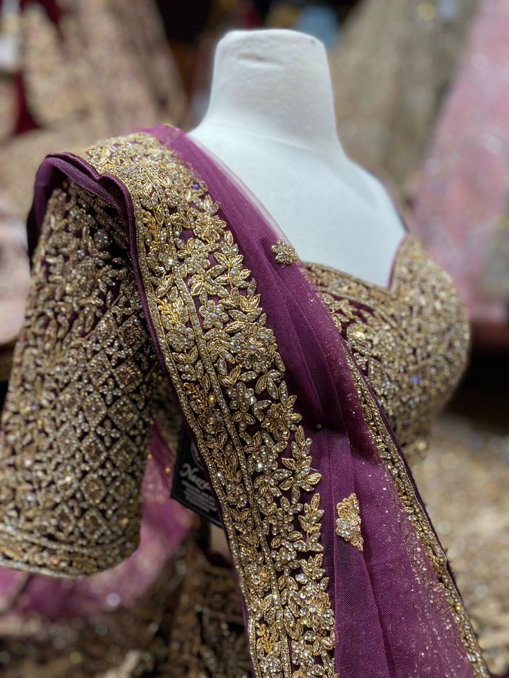 This wine red landed with multi-hued floral and birds embroideries and sequin, beads, zari and thread work lehenga with cut dana embroidery. Teamed up with similarly embroidered blouse and net dupatta. This wine red lehenga struck a chord with our voguish sensibilities and would satiate your bridal desires too. Fabric: Velvet Custom designed according to client measurements and color preference. Production and delivery time is 120 days! Party Wear Lehenga In Raw Silk With Dabka Work, Party Wear Raw Silk Choli With Intricate Embroidery, Party Wear Embroidered Lehenga In Raw Silk, Party Wear Traditional With Intricate Embroidery, Party Wear Traditional Drape With Intricate Embroidery, Party Wear Embroidered Fabric With Zari Work For Reception, Party Wear Sharara With Intricate Embroidery For Festivals, Party Wear Lehenga With Intricate Embroidery For Reception, Embroidered Party Wear Choli For Reception