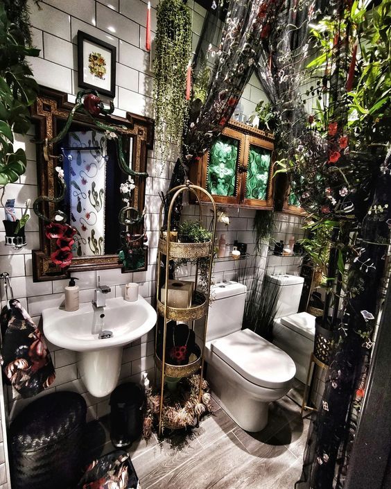 a bathroom decorated with plants and mirrors