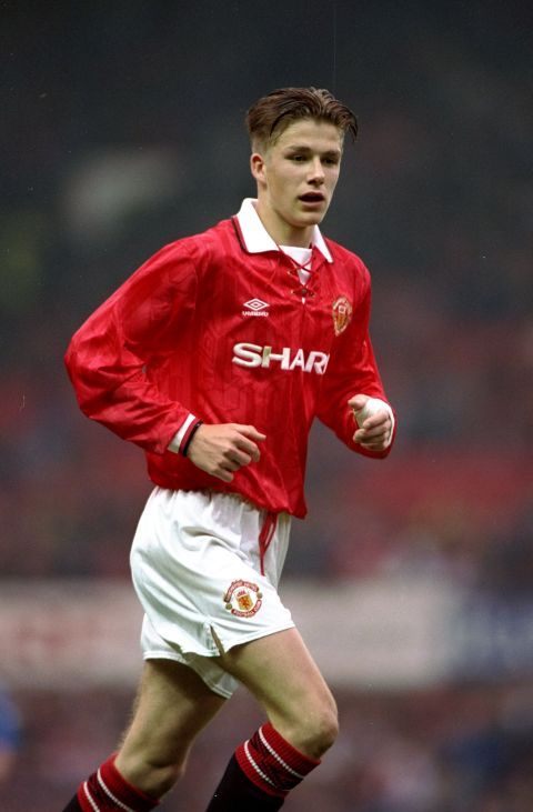 the young man is playing soccer on the field