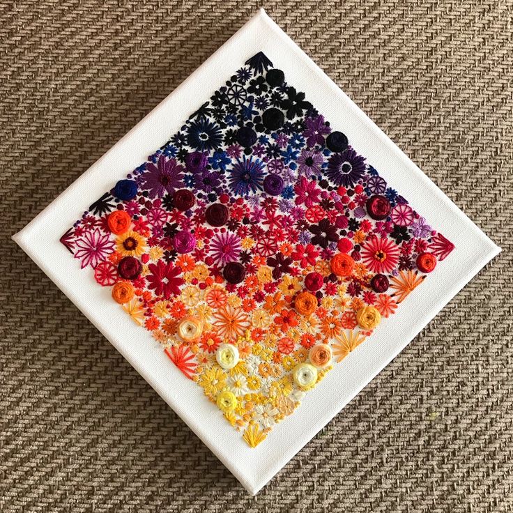 a white square with colorful flowers on it