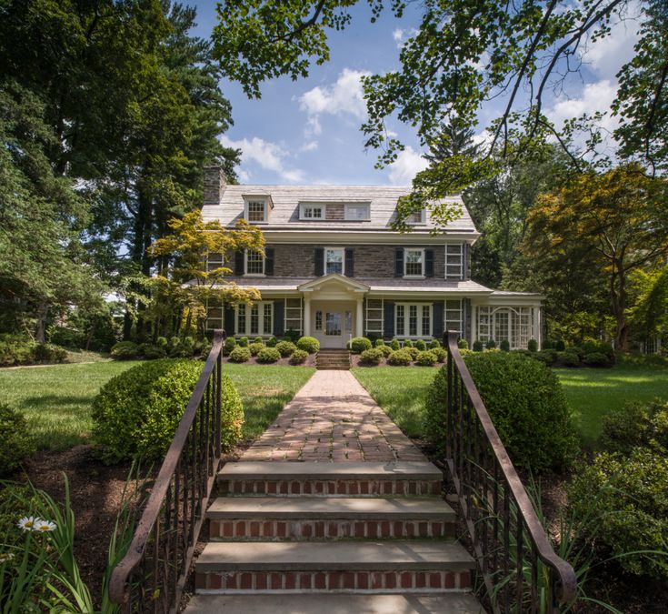 a large house with steps leading to the front door