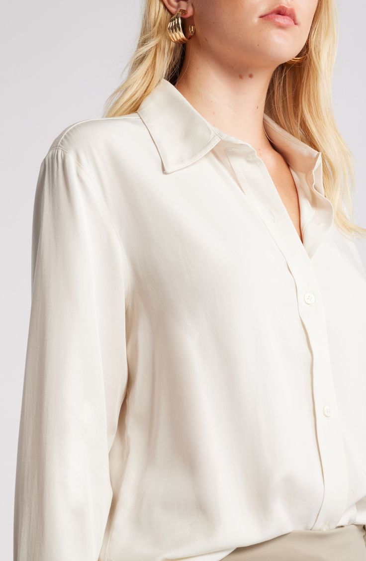 Cut in relaxed fit, this lightweight button-up shirt is what to wear on casual days whether you're in or out of the office. 29 1/2" length (size Medium) Front button closure Point collar Long sleeves with button cuffs 70% rayon, 30% lyocell Machine wash, line dry Imported Classic Long Sleeve Shirt With Back Button Closure, Effortless Everyday Tops With Spread Collar, Effortless Everyday Top With Spread Collar, White Long Sleeve Blouse With Hidden Button Closure, Effortless Collared Shirt With Rolled Sleeves, Cream Relaxed Fit Shirt With Buttons, Relaxed Fit Cream Shirt With Buttons, Classic Collared Blouse With Back Button Closure, Cream Spread Collar Shirt For Spring