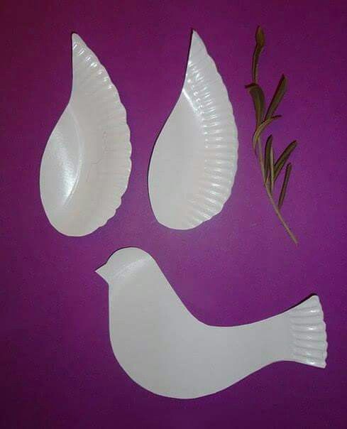 three paper plates shaped like birds on a purple surface