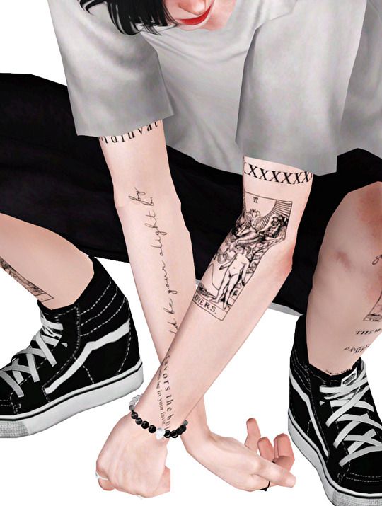 two people with tattoos on their arms and legs, one holding the other's hand