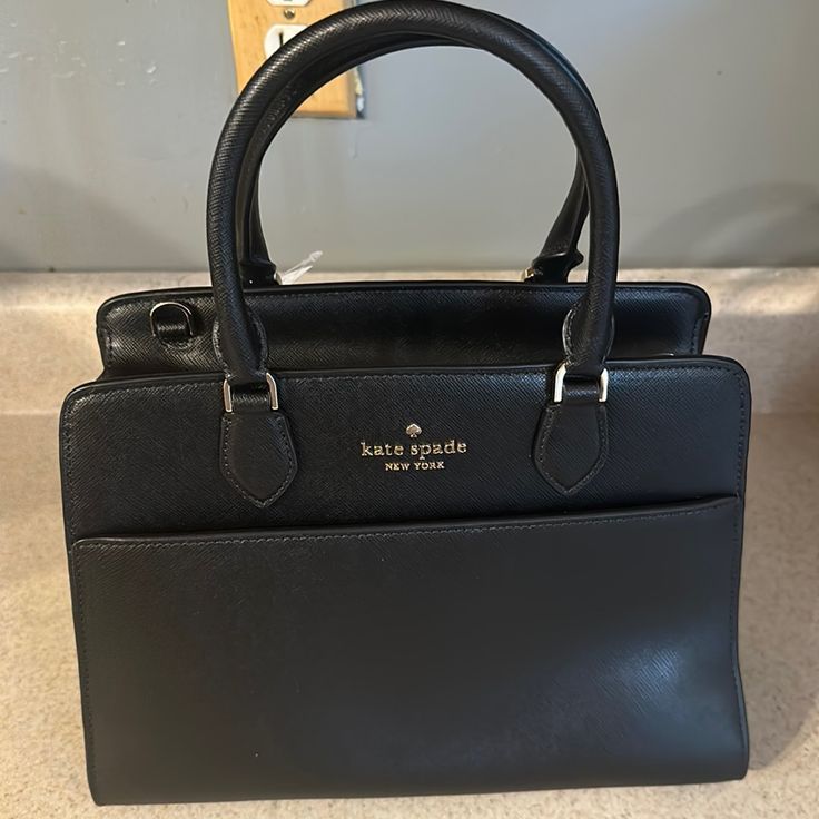 Black Kate Spade Saffiano Leather Medium Tote Bag. Brand New With Tags. Never Worn. Smoke Free Home Black Saffiano Leather Shoulder Bag, Black Saffiano Leather Shoulder Bag For Office, Kate Spade Saffiano Leather Bags, Classic Black Saffiano Leather Shoulder Bag, Elegant Black Saffiano Leather Shoulder Bag, Formal Black Saffiano Leather Shoulder Bag, Black Saffiano Leather Bag For Work, Elegant Kate Spade Shoulder Bag For Business, Formal Leather Kate Spade Bags