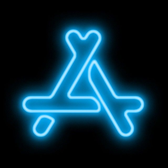 a neon sign with the letter x in it's center on a black background