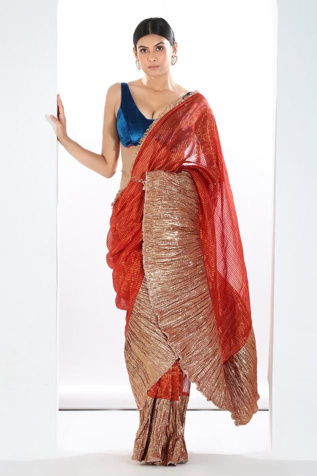 Red, metallic rust pre-draped metallic colorblock saree with stripe woven motifs and textured pattern. Paired with velvet padded blouse and belt.
Components: 3
Type Of Work: Textured
Neckline: Blunt V neck
Sleeve Type: Sleeveless
Fabric: Saree: Metallic Striped Tissue, Blouse: Velvet, Lining: Artificial Crepe
Color: Red,Orange
Other Details: 
Length: 
Saree: 42 inches
Blouse: 14 inches
Approx. product weight: 2 kgs
Note: Only the product mentioned in the description is being sold
Occasion: Desti Padded Blouse, Drape Saree, Blouse For Women, Saree With Blouse, Blouse Online, Red Blouses, Aza Fashion, Sleeve Type, Color Blocking