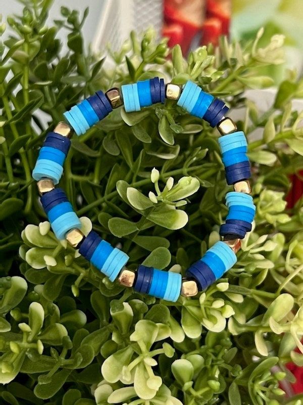 This is a Blue Clay Beaded Bracelet.  Comes with 1 surprise! <3 Casual Blue Beaded Bracelet With Large Beads, Casual Blue Bracelets With Large Beads, Casual Blue Beaded Stretch Bracelet, Blue Stretch Bracelet With Colorful Beads For Vacation, Blue Friendship Bracelets With Colorful Beads For Vacation, Casual Blue Stretch Bracelet With Large Beads, Casual Blue Jewelry With Large Beads, Blue Heishi Beads Bracelets With Spacer Beads, Blue Heishi Beads Bracelets