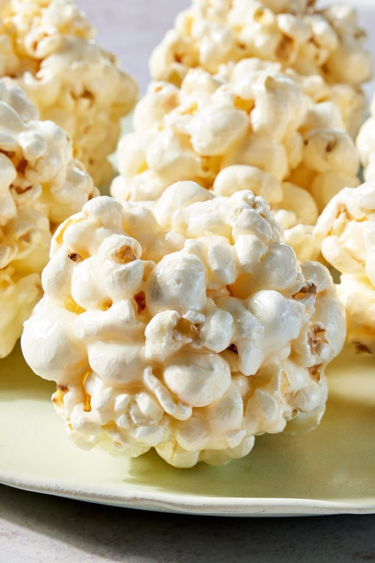 three pieces of popcorn sitting on top of a plate