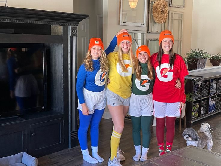 three girls in matching outfits standing next to each other