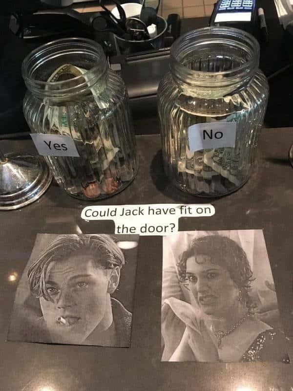 two jars filled with money sitting next to each other on top of a countertop