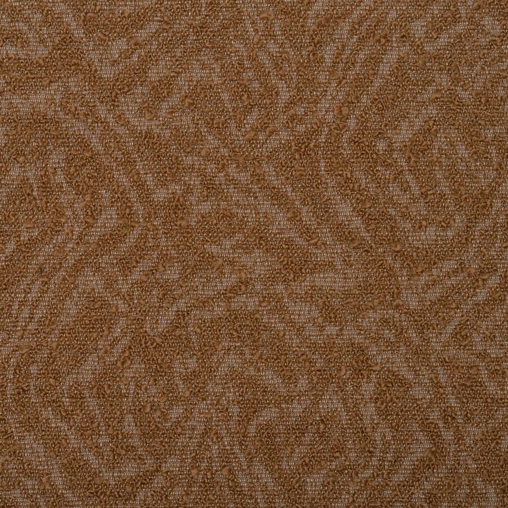 an upholstered brown fabric textured with small, intricate designs on the outside