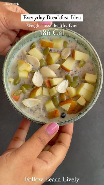 a person holding a bowl of food in their hand