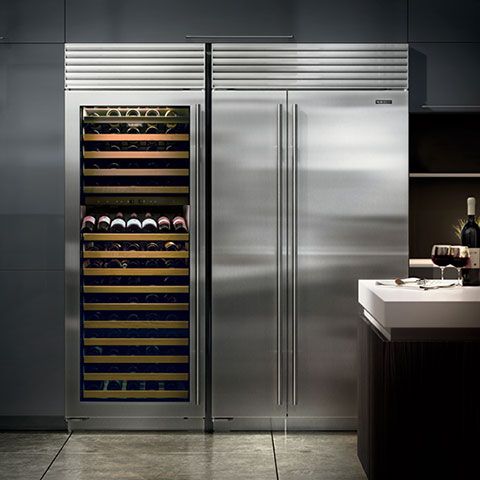 a stainless steel refrigerator with wine bottles in it