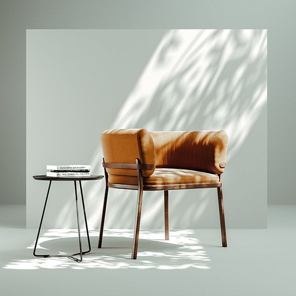 a brown chair sitting next to a table on top of a white floor in front of a wall