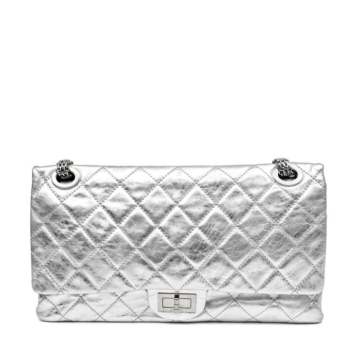 This Chanel Metallic Silver 2.55 Reissue Maxi Flap Bag is in excellent condition. The largest silhouette in the reissue, the 228 size is spacious without being overwhelming. Intentionally distressed metallic silver calfskin is further quilted in signature Chanel diamond pattern. Silver mademoiselle twist lock secures the exterior flap. Dark silver leather interior. Bijoux style chain strap may be carried single or double. Made in France. Proudly offered from Only s for $9,250.00. Payment by bank wire only. Measurements: 14” x 8” x 4” drop: 11” double/ 18” single” Please email Concierge@onlys.com for additional photos of this item. PBF 12452 Handbag Wallet, Pocket Bag, Wallet Accessories, Flap Bag, Diamond Pattern, Leather Interior, Dior Bag, Chain Strap, Wallet Case