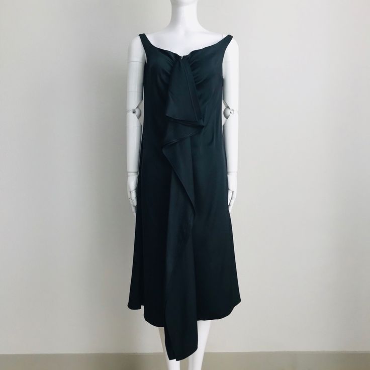 Simple, Elegant And Sophisticated Sleeveless Dress With A Vintage Flair. Wide Scoop Neckline. Zip Front With Hook And Eye Closure. Cascading Ruffles On Front. A-Line Silhouette. Unlined. Made In Italy. Color: Black. Fabric: 100% Silk. Size: It 44 / Us 8. Measurement When Garment Laid Flat Approximately - Bust: 18”, Waist: 17”, Hips: 20”, Length: 42” (50”Including The Front Ruffle). Nwt (Store Tag Only, No Original Hangtag). Never Worn. Store Handled. Can Provide More Info And Pictures. Pre-draped Sleeveless Evening Dress With Ruffles, Pre-draped Sleeveless Dress With Ruffles, Pre-draped Sleeveless Dress For Dinner, Formal Sleeveless Evening Dress With Ruffles, Sleeveless Ruffled Midi Dress For Evening, Sleeveless Midi Dress With Ruffles For Evening, Chic Sleeveless Evening Dress With Ruffles, Chic Evening Dress With Ruffles And Asymmetrical Neckline, Elegant Evening Sleeveless Dress With Asymmetrical Neckline