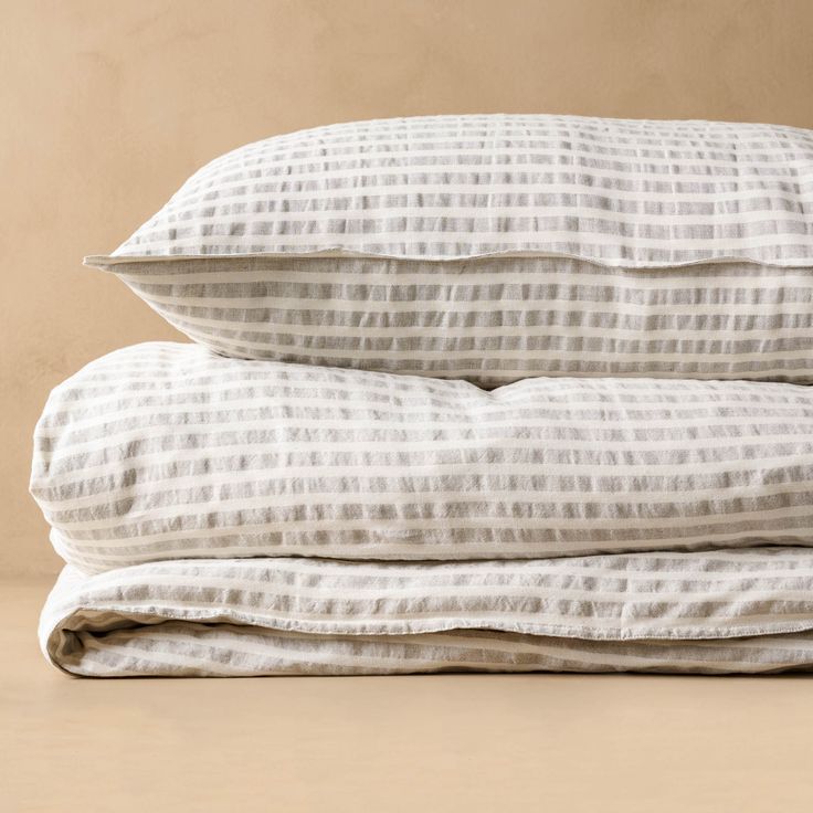 three pillows stacked on top of each other