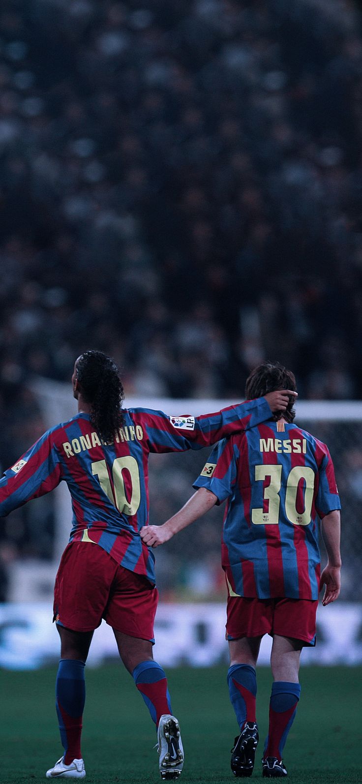 two men are playing soccer on the field