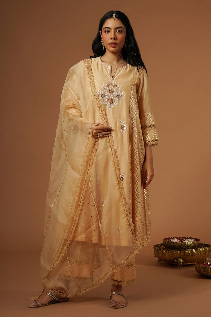 Peach brocade panelled kalidaar kurta with floral, thread and mukaish hand embroidery. Paired with pant and dupatta.
Components: 3
Pattern: Embroidered
Type Of Work: Floral
Neckline: Notched v neck
Sleeve Type: Three quarter
Fabric: Silk Chanderi
Color: Peach
Other Details: 
Lace detailing
Floral embroidery
Occasion: Mehendi and Haldi - Aza Fashions Kalidaar Kurta, Kurta Set For Women, Fabric Silk, Kurta Set, Set For Women, Aza Fashion, Sleeve Type, Floral Embroidery, Three Quarter