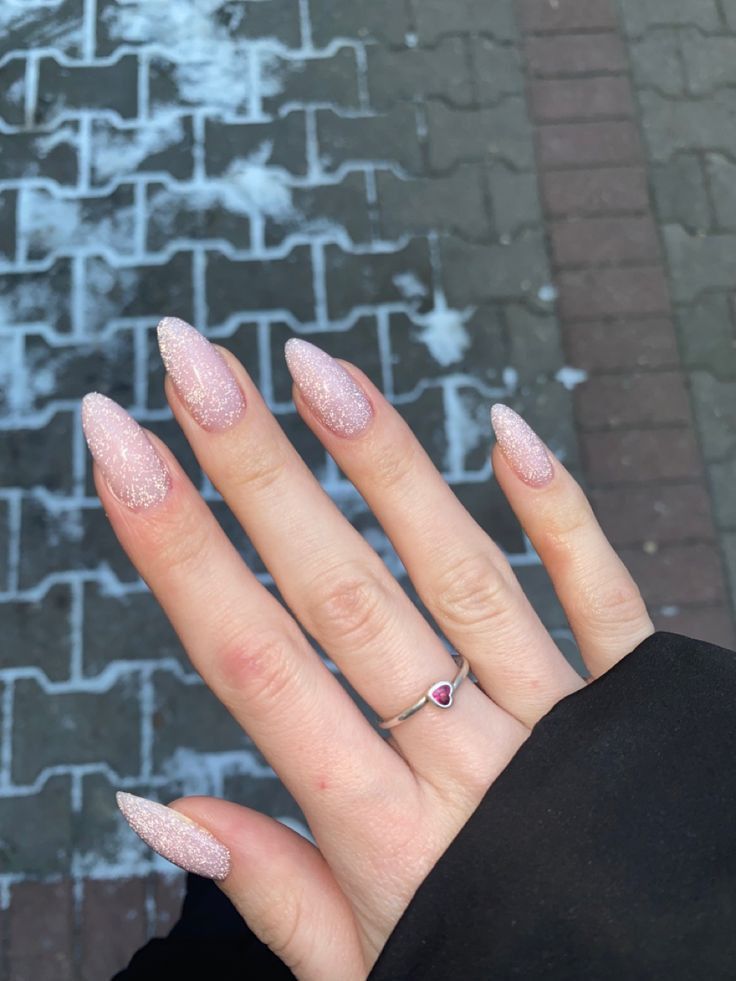 Almond Nails Sparkle Glitter, Glitter Oval Acrylic Nails, White Sparkly Nails Almond, Pink Sparkle Nails Almond, Glittery Nails Almond, Classy Nye Nails, Sparkly Glitter Nails, Pale Pink Glitter Nails, Pink Sparkling Nails