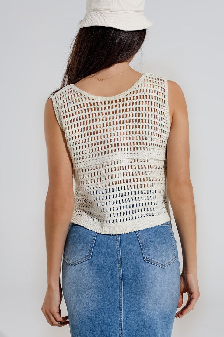 Subcategory: Vest . Neck: V-neck neckline. Sleeves: Sleeveless style. Fit: Relaxed fit. Style: Boho. Detail: Cable knit . Fabric: Crochet. Zipper: Button placket. runs true to size. U. 60% Cotton 40% Polyester Fitted V-neck Summer Vest, Summer Cotton V-neck Vest, Chic V-neck Crochet Top For Day Out, Summer V-neck Knit Top For Day Out, Sleeveless Summer Knit Top For Beach, Casual V-neck Crop Top For Beach, White Knit V-neck Tank Top, V-neck Knit Crochet Top, White V-neck Knit Tank Top