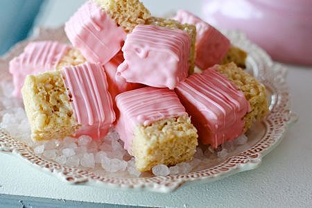 some pink marshmallows are on a plate