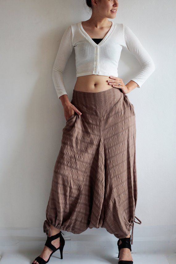 Beautiful double layer fabric made of cotton/linen blend.  High quality and stunning beauty. The fabric is unbleached and undyed, you can see the bark fibres in it! Subtle stripe patternDrop-crotch style pants, baggy pants, tribal pants with a twist.3 ways to wear. with drawstring on the hem. You can wear it with drawstring loose. Like a wide leg pants. Even look like A shape sweet skirt.You can also draw the string and get a balloon shape pants.Or...you can put the hem above your knee and get a Bohemian Brown Cotton Pants, Bohemian Cotton Wide Leg Pants With Relaxed Fit, Cotton Harem Pants For Fall Festival, Summer Lagenlook Harem Pants With Relaxed Fit, Summer Lagenlook Relaxed Fit Harem Pants, Bohemian Brown Cotton Harem Pants, Brown Cotton Harem Pants For Fall, Loosely Fitted Harem Pants For Fall, Bohemian Cotton Wide-leg Harem Pants