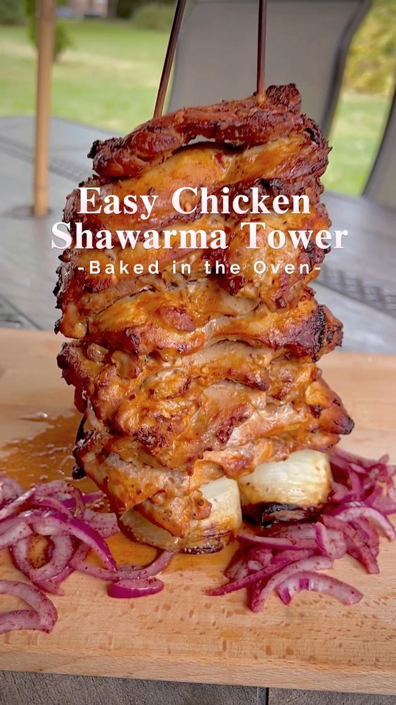 a stack of food sitting on top of a wooden cutting board