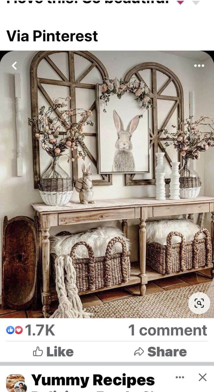 a table with baskets on top of it and an image of a bunny in the mirror