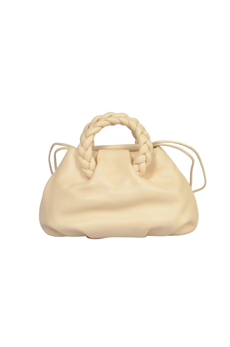 Bombon Shoulder Bag from Hereu Designer Beige Bags With Braided Handles, Luxury Shoulder Bag With Round Handle For Errands, Trendy Evening Satchel With Braided Handles, Elegant Shoulder Bag With Braided Round Handles, Evening Bucket Bag With Braided Handles, Elegant Beige Hobo Bag With Braided Handles, Elegant Satchel With Braided Handles, Designer Cream Bag With Braided Handles, Designer Cream Bags With Braided Handles