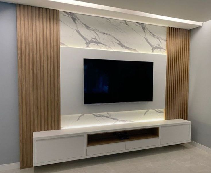 a large flat screen tv mounted to the side of a wall