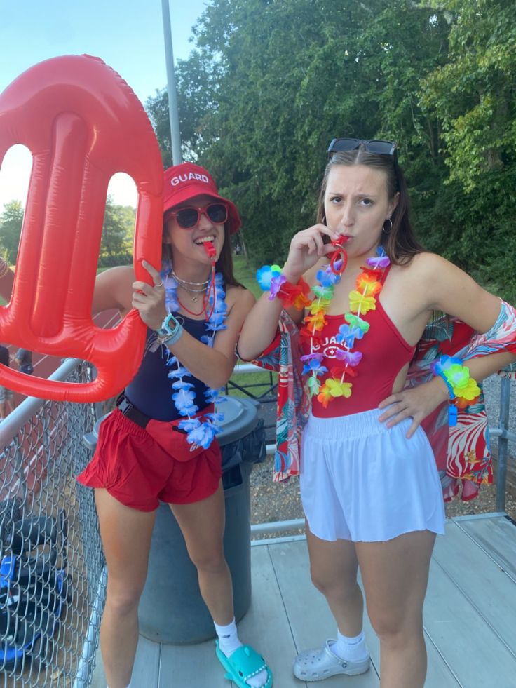 two women dressed in costumes standing next to each other