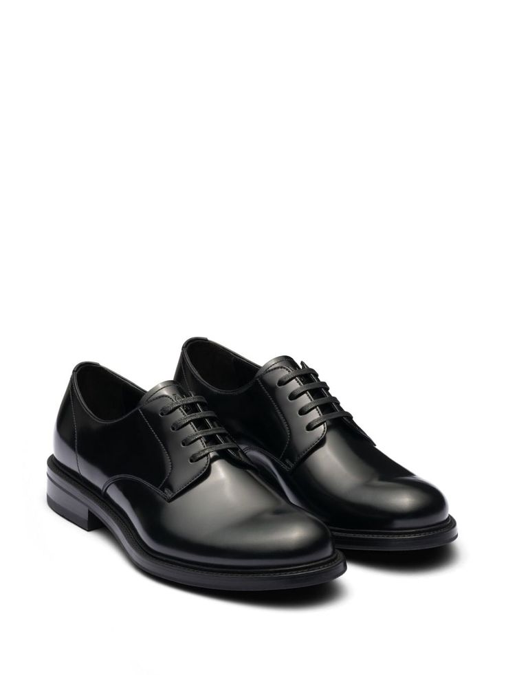 Find PRADA Leather Derby Shoes on Editorialist. black leather brushed finish panelled design logo-debossed tongue branded insole almond toe front lace-up fastening low stacked heel rubber outsole Modern Black Lace-up Shoes For Formal Occasions, Black Calf Leather Oxfords For Derby, Modern Black Wingtip Lace-up Shoes, Black Calf Leather Derby For Work, Black Calf Leather Derby Shoes For Work, Black Lace-up Shoes With Contrast Sole For Work, Black Cap Toe Dress Shoes With Textured Sole, Black Calf Leather Derby Shoes With Round Toe, Black Textured Sole Lace-up Calf Leather Shoes