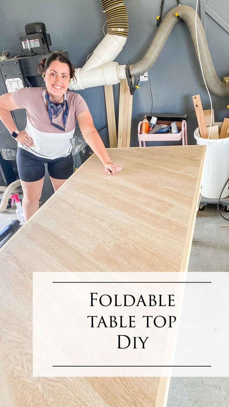 a woman standing in front of a table with the words foldable table top diy