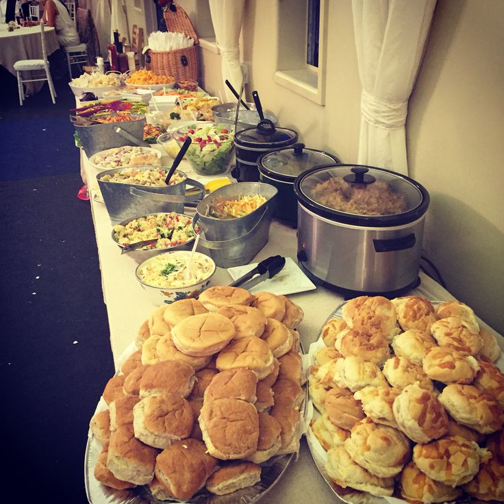 a buffet table filled with lots of food