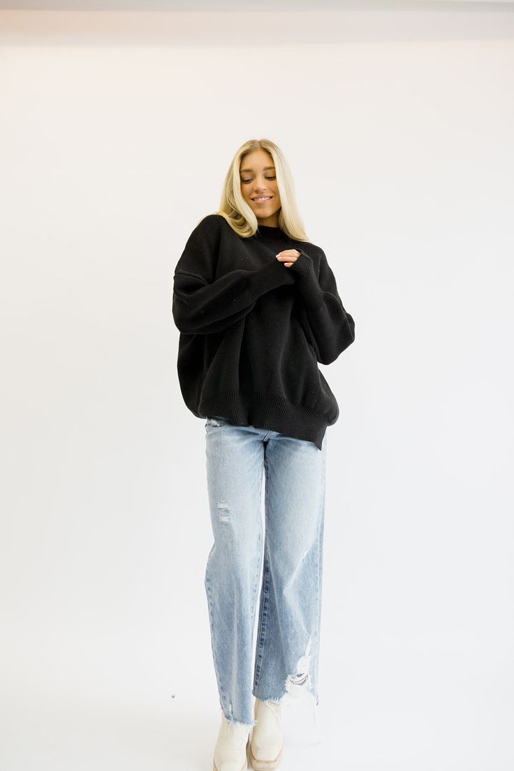 The coziest, most comfortable sweater! It is so versatile and looks good with everything. Everyone needs a sweater like this in their closet! Fits true to size being oversized. Order your true size! Styled with our 90’s High Rise Jeans. Model Info: Makena is 5’6 wearing size S/M. Oversized Turtleneck Sweater For Everyday, Comfy Everyday Soft Knit Sweater, Comfy Layering Sweater, Everyday Relaxed Fit Chunky Knit Sweater, Everyday Chunky Knit Sweater In Relaxed Fit, Everyday Chunky Knit Sweater With Relaxed Fit, Cozy Oversized Sweater For Layering, Oversized Black Soft Knit Top, Cozy Relaxed Fit Soft Knit Sweater