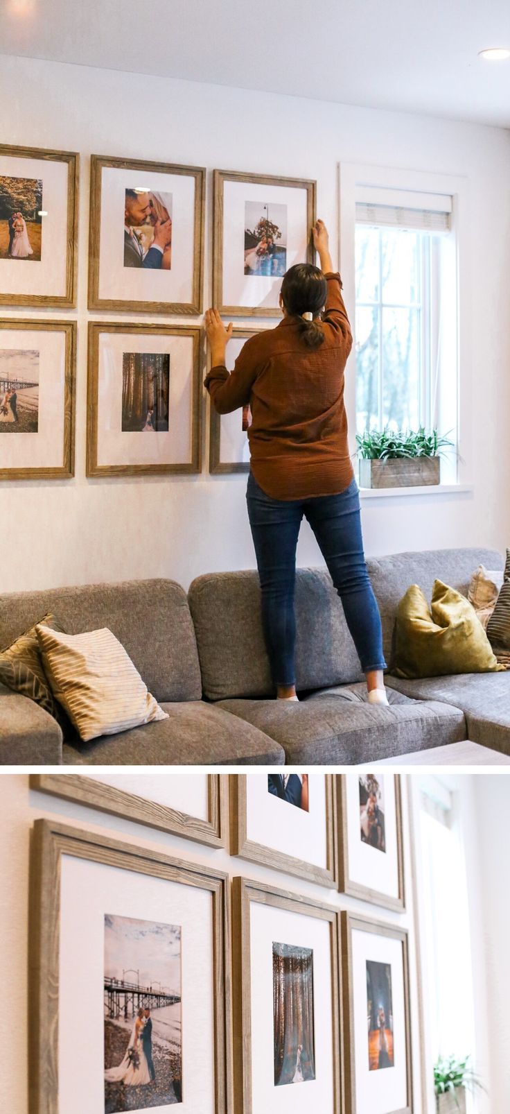 a woman standing on top of a couch in front of pictures hanging on the wall