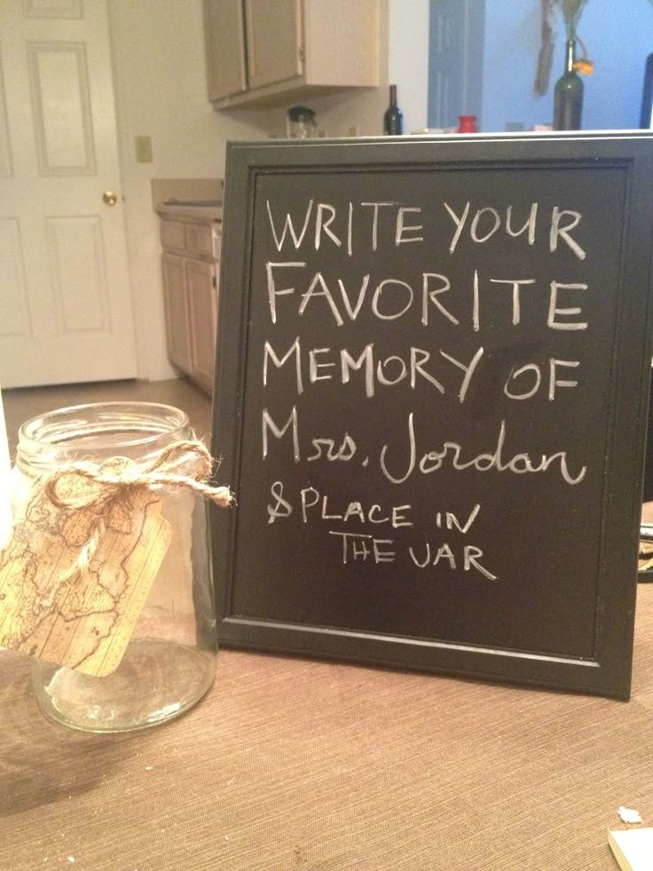 a chalkboard sign with writing on it next to a jar filled with wine corks