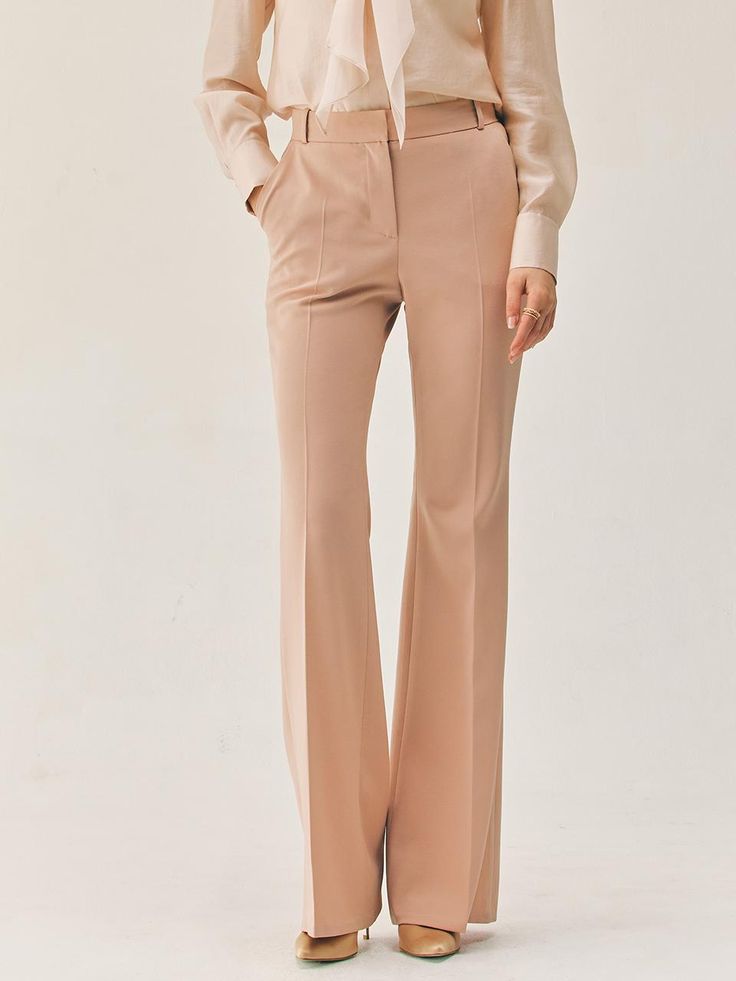 This product features the Vashti bootcut trousers, which are a contemporary update on a classic style. The trousers boast a flattering bootcut silhouette that gently flares from the knee to hem, creating an elongated look. Tailored to perfection, these trousers sit at the natural waist and are designed to offer both comfort and a streamlined appearance. - The bootcut silhouette of these trousers offers a flattering shape that balances proportions and elongates the legs.- Sitting comfortably at the natural waist, they provide a fit that's both secure and stylish.- Tailored construction ensures a polished look, ideal for a professional setting or a sophisticated casual outfit.- These trousers are a versatile staple, easily paired with various tops and shoes for a range of occasions. Spring Workwear Wide Leg Flares, Elegant Spring Flares For Workwear, Elegant Straight Leg Flares For Workwear, Fitted Flares For Workwear In Spring, Formal Flare Wide Leg Pants For Spring, Chic Spring Workwear Flares, Formal Spring Flared Wide Leg Pants, Spring Formal Flare Wide Leg Pants, Elegant Full Length Spring Flares