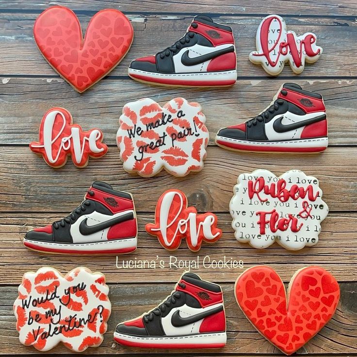 decorated cookies are arranged in the shape of sneakers and heart - shaped cookie cutters