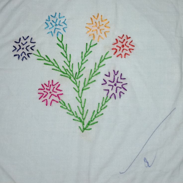 a white cloth with multicolored snowflakes on it