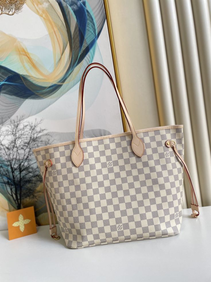 Damier Azur coated canvas Size: 31 x 28 x 14 cm / 12.6 x 11.4 x 6.7 inches Includes Shipping bags, dust bag sleeper, care manual, booklet, tag. Colorful Textiles, Louis Vuitton Neverfull Mm, Neverfull Mm, Vuitton Neverfull, Tote Bag Leather, Vuitton Bag, Louis Vuitton Neverfull, Leather Handle, Cowhide Leather